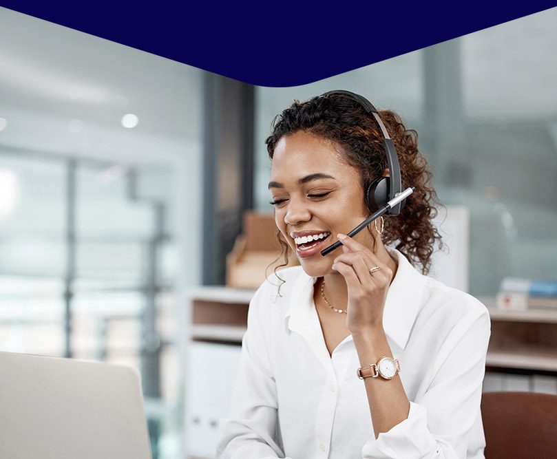 Graphic of a smiling all centre agent talking to a customer with headset